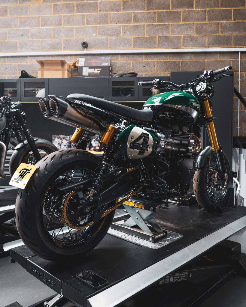 A picture of a green Triumph Scrambler supermoto custom designed by Thornton Hundred Motorcycle